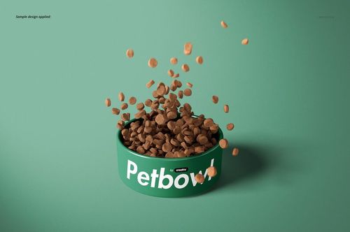 Pet bowl mockup featuring a green dish with scattered kibble, placed on a plain teal surface, seen from the front.
