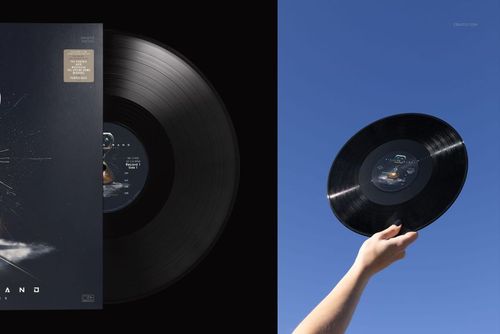 PSD mockup featuring a black vinyl record, displayed both in a hand outdoors and flat against a dark background.