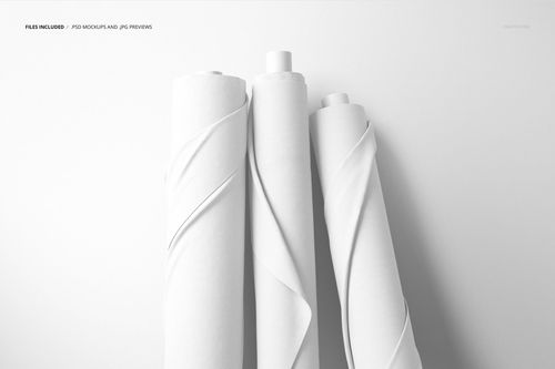 White textile rolls displayed upright in a minimalistic scene, suitable for use in a fabric PSD mockup.