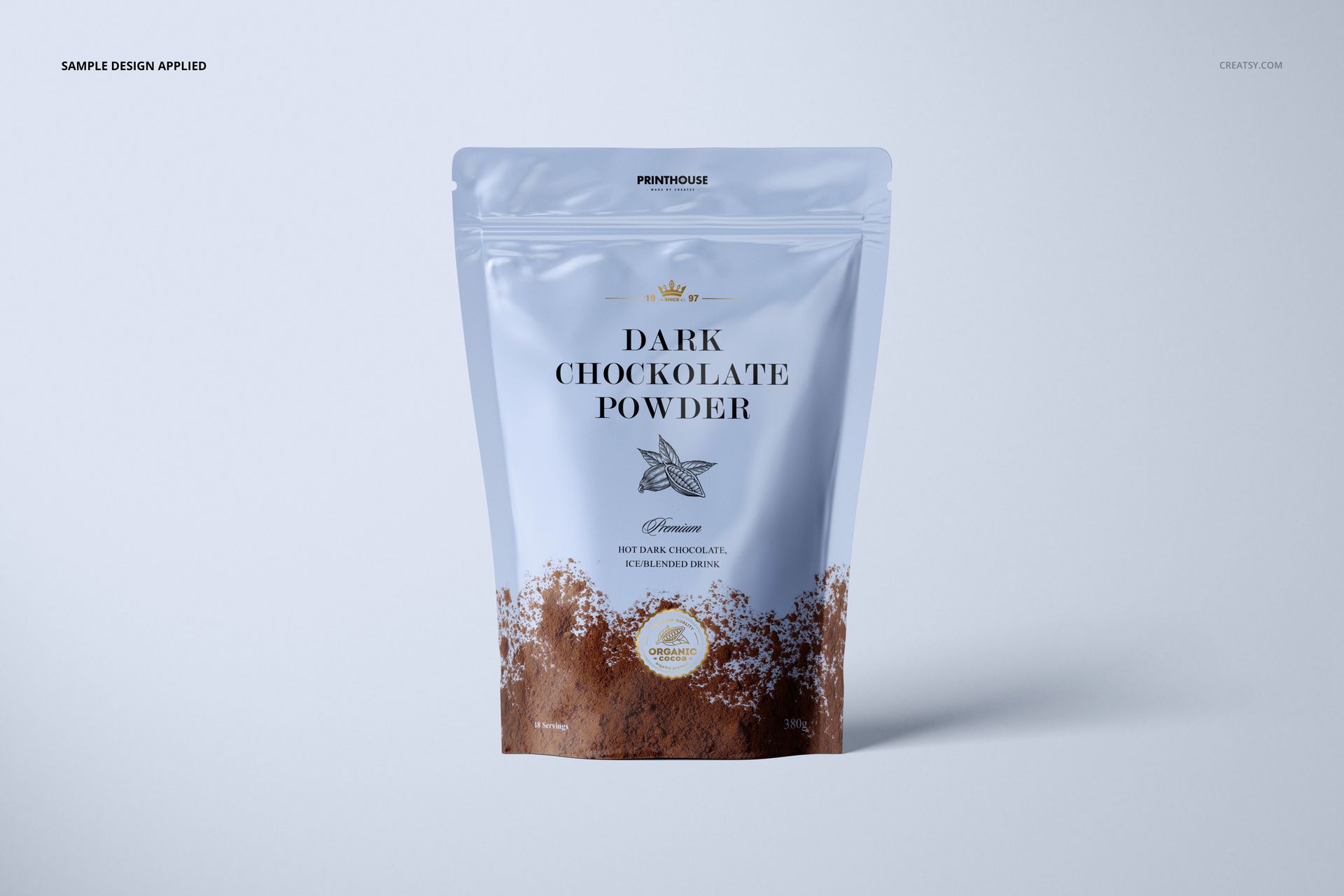 Front view of a glossy zip lock pouch mockup featuring brown cocoa powder graphics and elegant text on a pale surface.