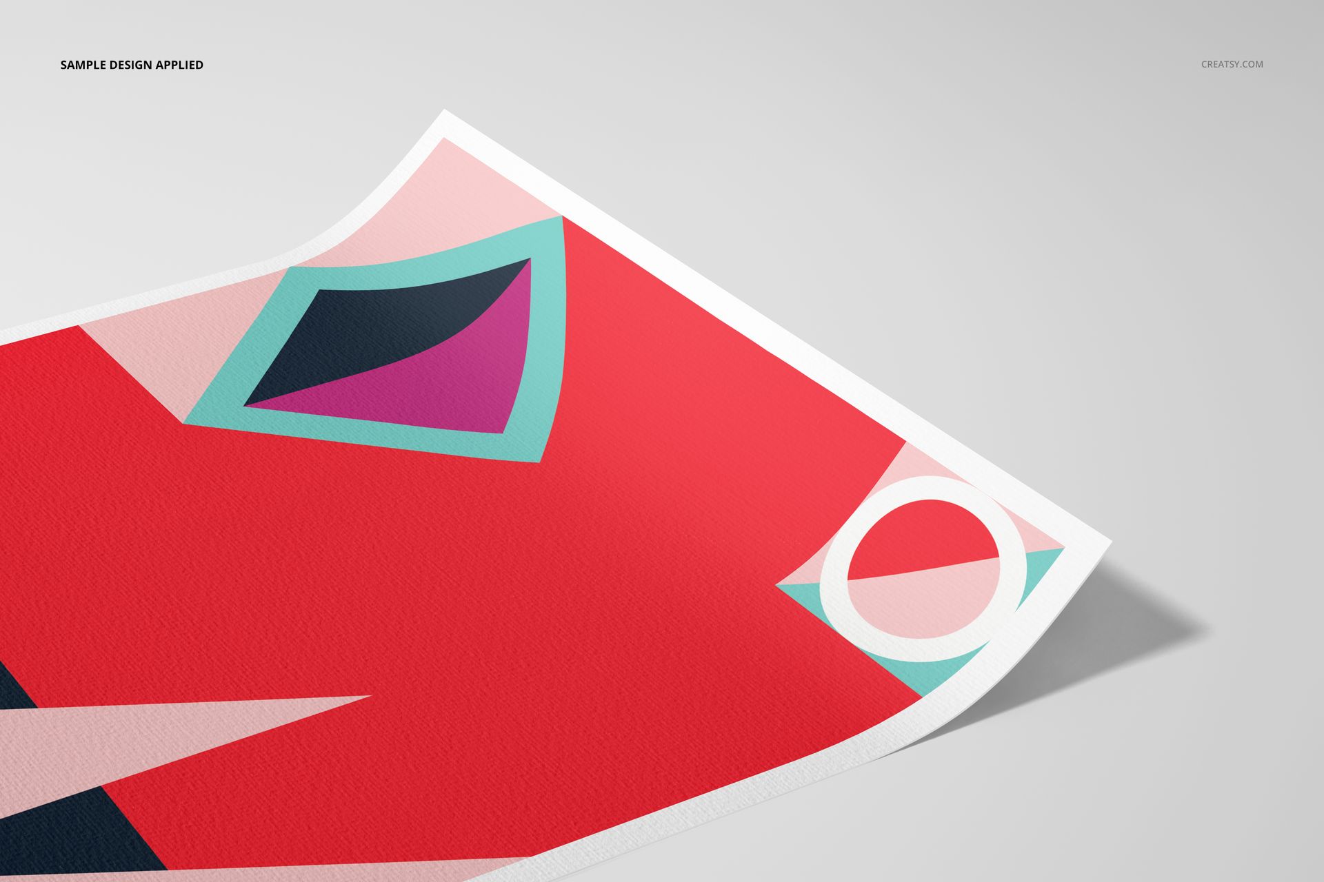 Close-up of a fine art print mockup on textured paper, featuring abstract geometric shapes in red, teal, and pink.