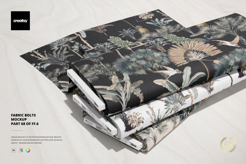 Stacked fabric bolts featuring tropical leaf and tree designs in muted colors, shown in a realistic PSD mockup setting.