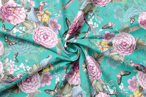Cotton fabric mockup featuring a swirl crease, decorated with butterflies, birds, and pastel flowers on turquoise.