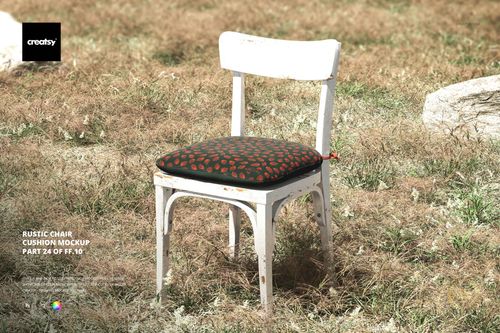 PSD mockup showing a weathered white chair and patterned cushion, positioned on dry grass surrounded by rocks.