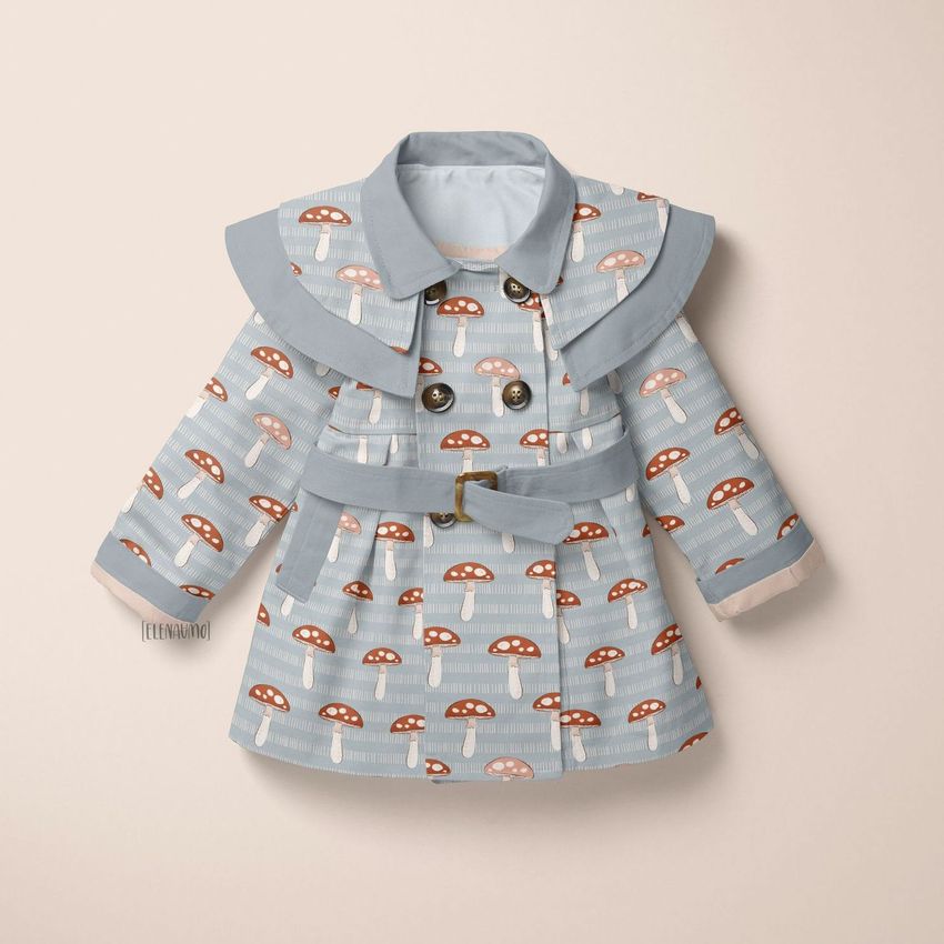 Kids coat mockup featuring a light blue baby coat with a red and white mushroom pattern, displayed on a neutral background.