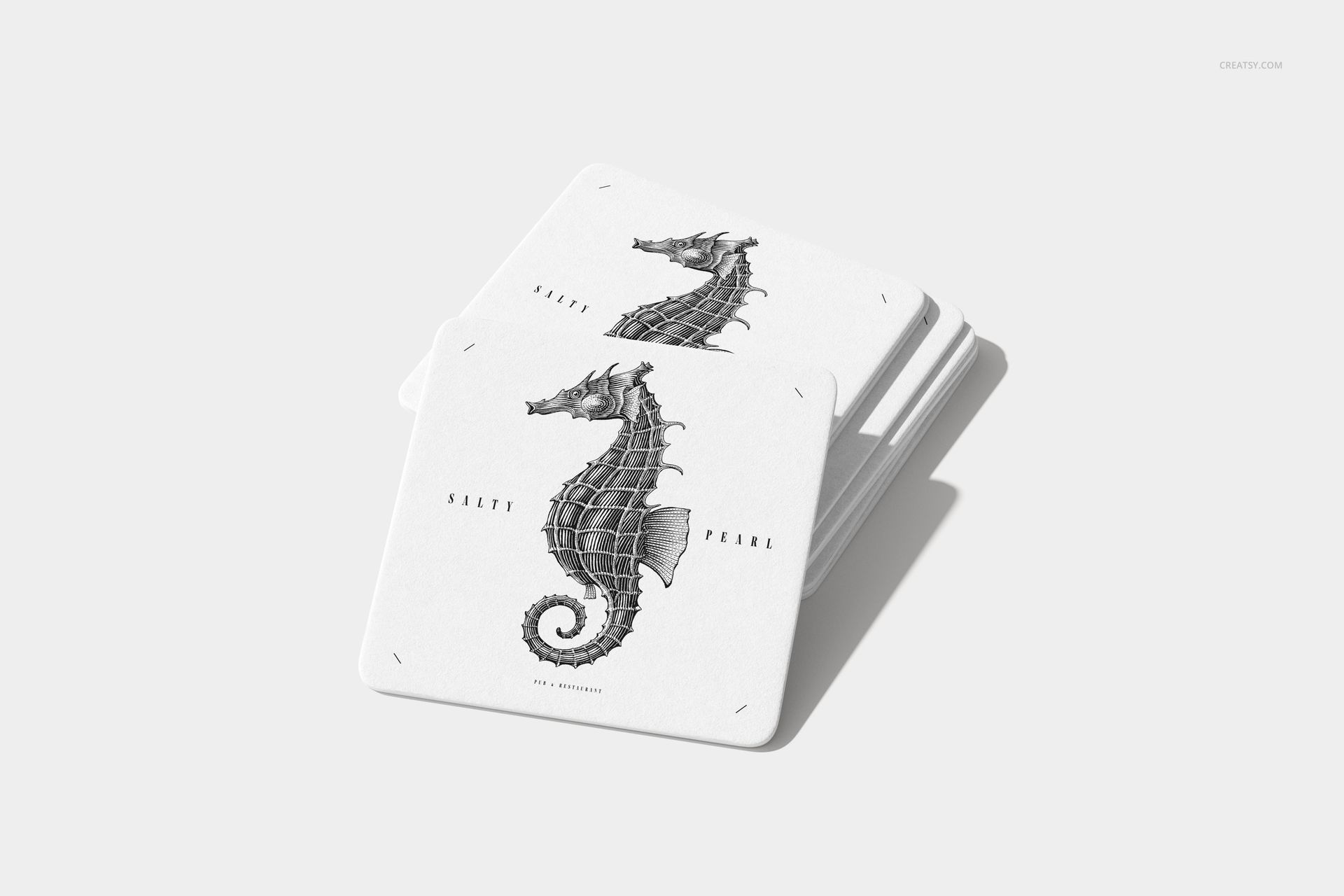 Square coaster mockup set displaying a monochrome seahorse graphic, with the coasters arranged on a plain surface.