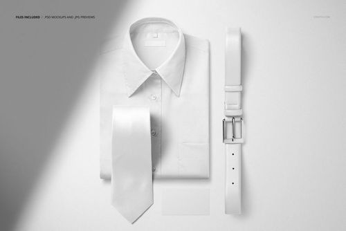 White men’s dress shirt, tie, and leather belt arranged side by side with a blank business card, shown in a PSD mockup.