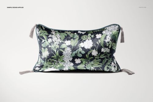 PSD mockup of a rectangular cushion with tassels, displaying botanical floral artwork on a neutral background.