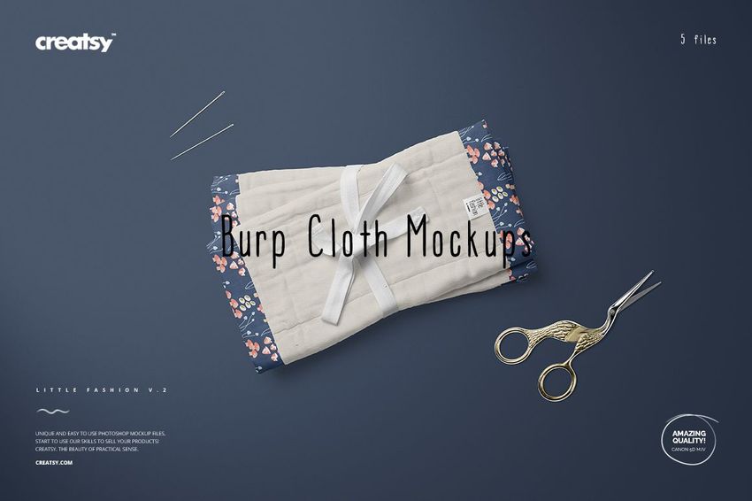 Burp cloth mockup set featuring a cream quilted fabric bordered by navy floral print, displayed with sewing tools on a blue background.