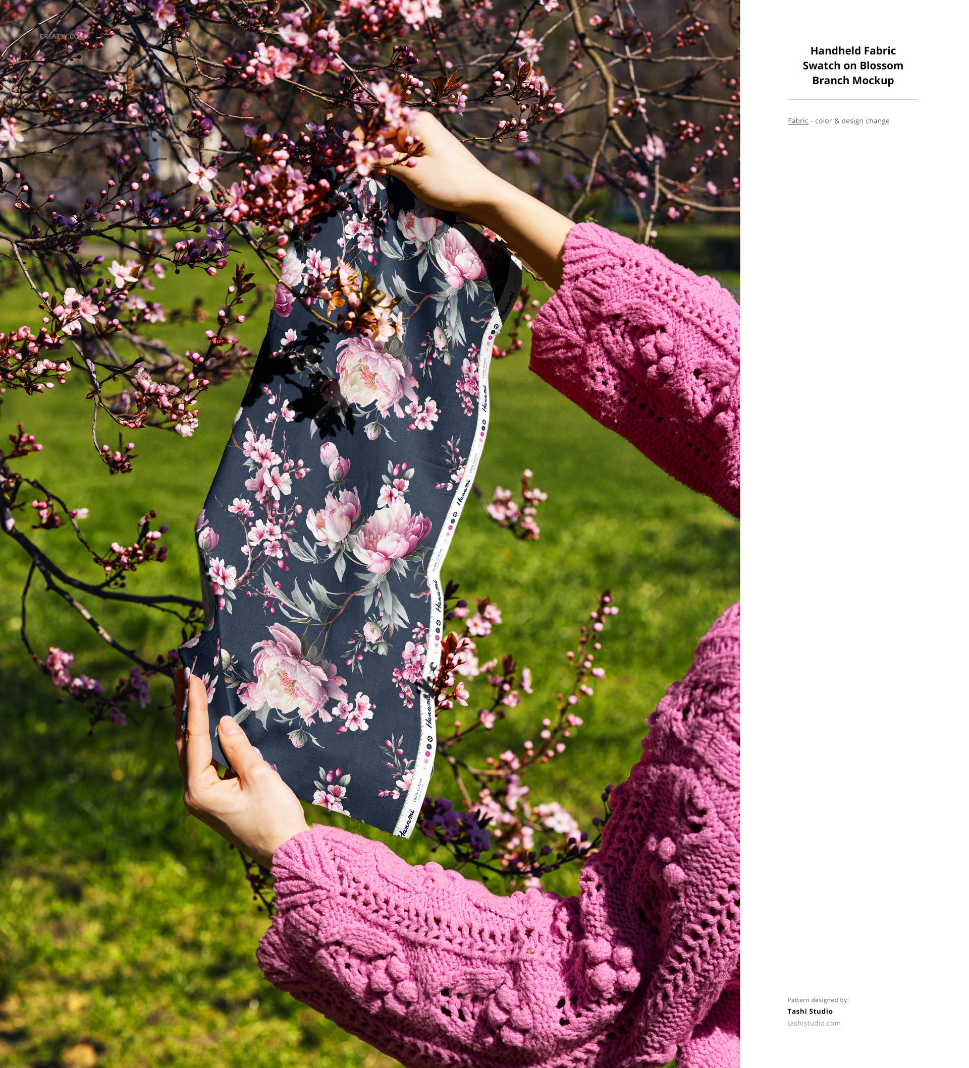 Floral fabric PSD mockup displayed outdoors, held up against branches with pink blossoms and green grass background.