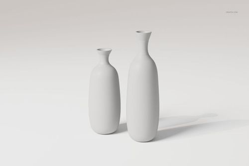 Front view of two clear glass vases with smooth surfaces, one taller and one shorter, on a plain light background.