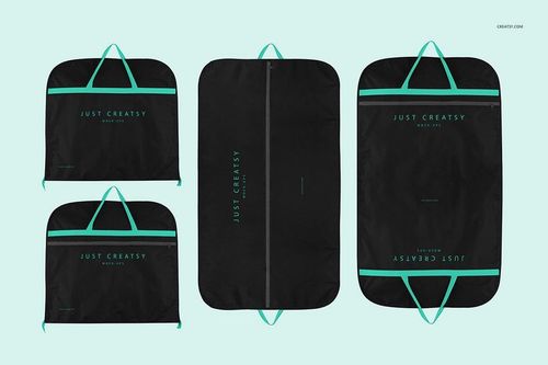 PSD mockup showing multiple suit covers in black with teal details, arranged flat against a neutral blue background.