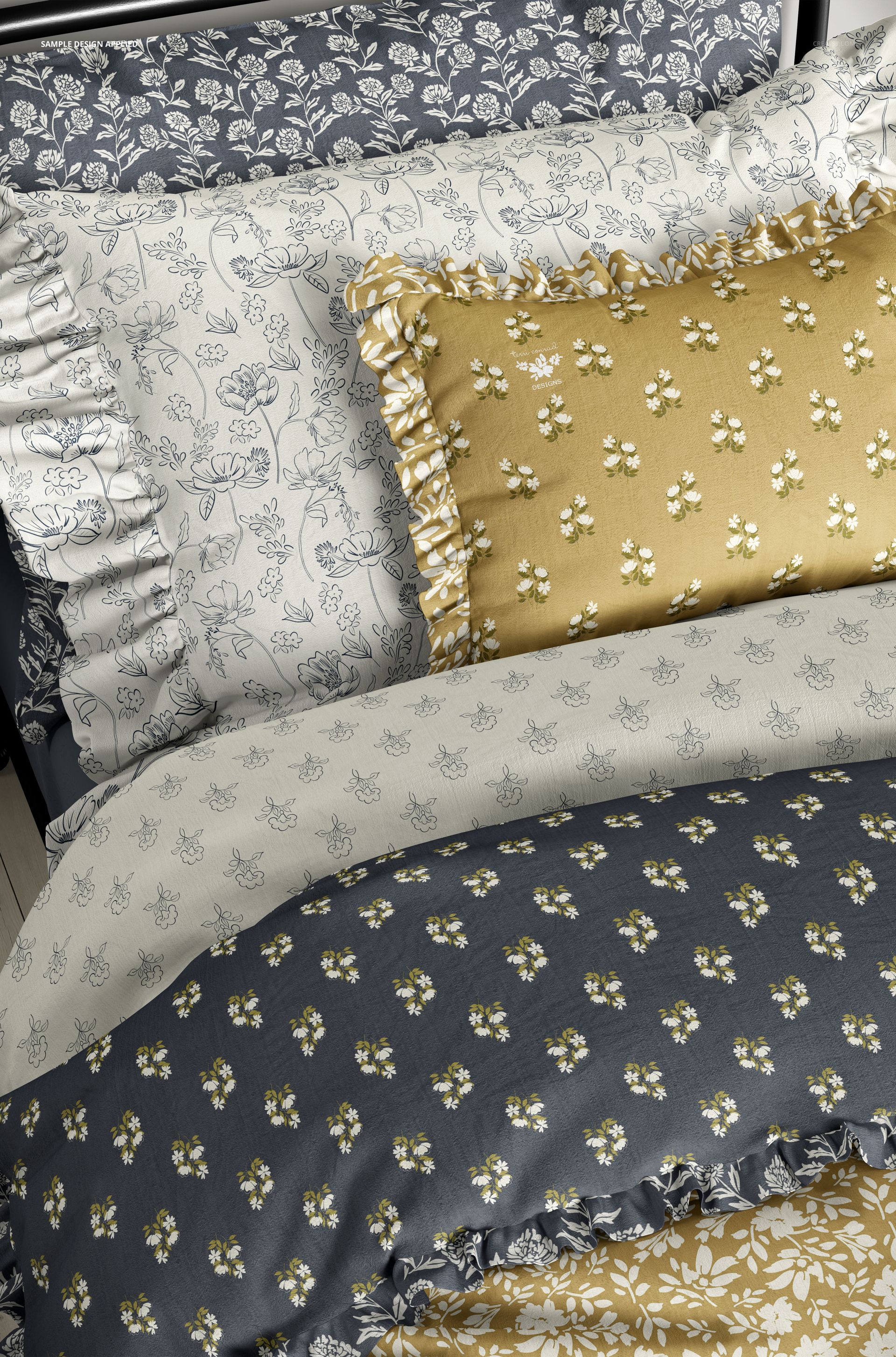 PSD mockup of bedding set with ruffled pillows and duvet covers in coordinating floral prints and soft colors.