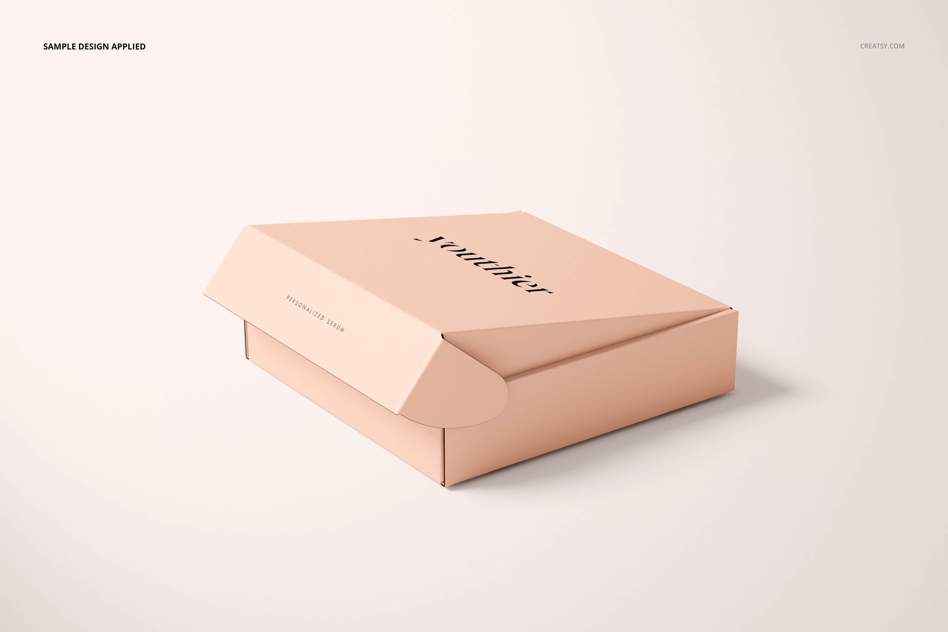 Peach-colored mailing box mockup shown from a front angle, featuring minimalist text and a clean, neutral setting.