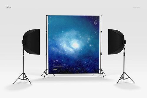 Custom printed backdrop mockup showing a cosmic blue pattern, flanked by two softbox lights in a studio setting.