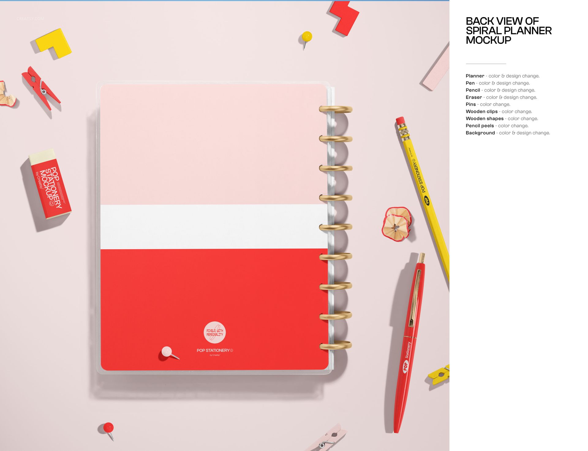 Colorful spiral planner mockup with gold rings, red and yellow stationery, and paper clips on a light background.