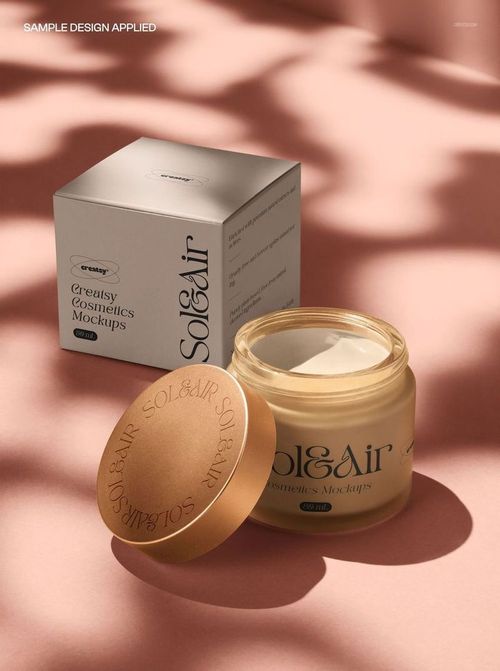 PSD mockup featuring an open cream jar and packaging box, illuminated by natural light on a pink surface.