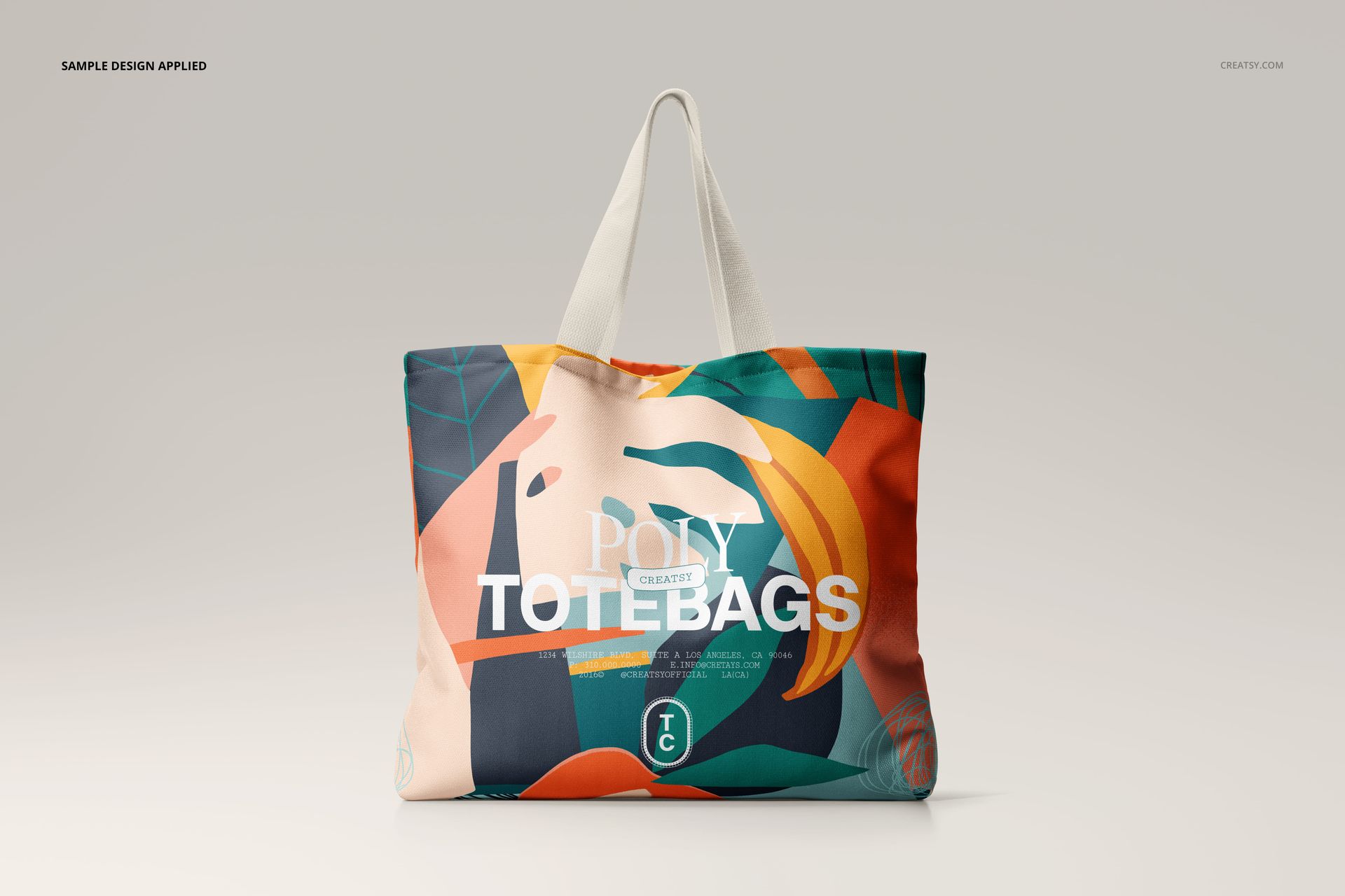 Front view of a spacious canvas tote bag mockup featuring bold geometric shapes and vibrant colors.