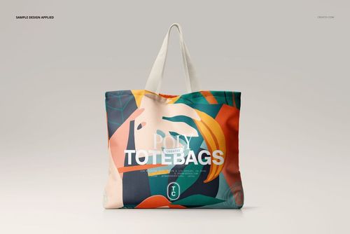 Front view of a spacious canvas tote bag mockup featuring bold geometric shapes and vibrant colors.