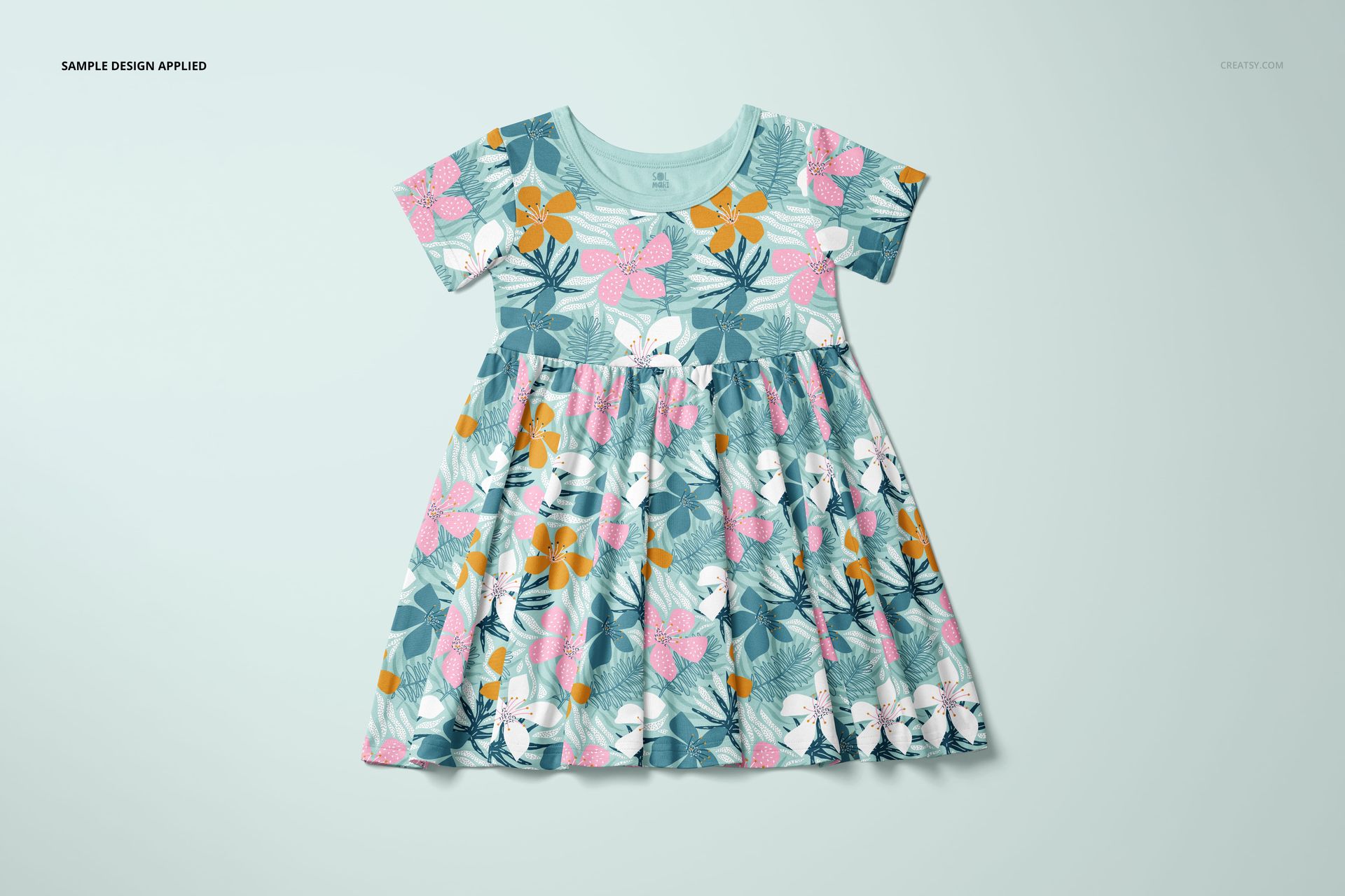 Front view of a toddler skater dress mockup with short sleeves, featuring a floral pattern in pink, orange, and white on a teal background.