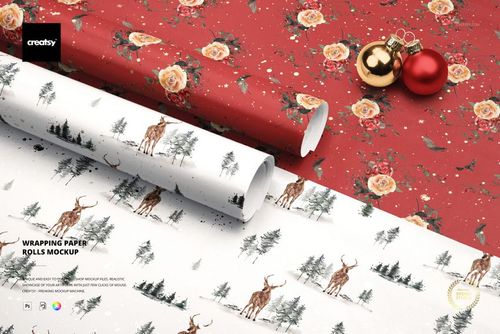 Christmas-themed wrapping paper rolls mockup featuring red floral and white woodland designs, shown from a top angle.