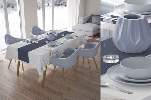 Table textiles mockup showing a rectangular table covered with marble and navy fabrics, set for a meal with gray tableware.