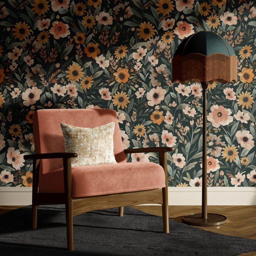 Armchair mockup in a home interior scene with a floral patterned wallpaper, a standing floor lamp, and a dark rug on wooden flooring.