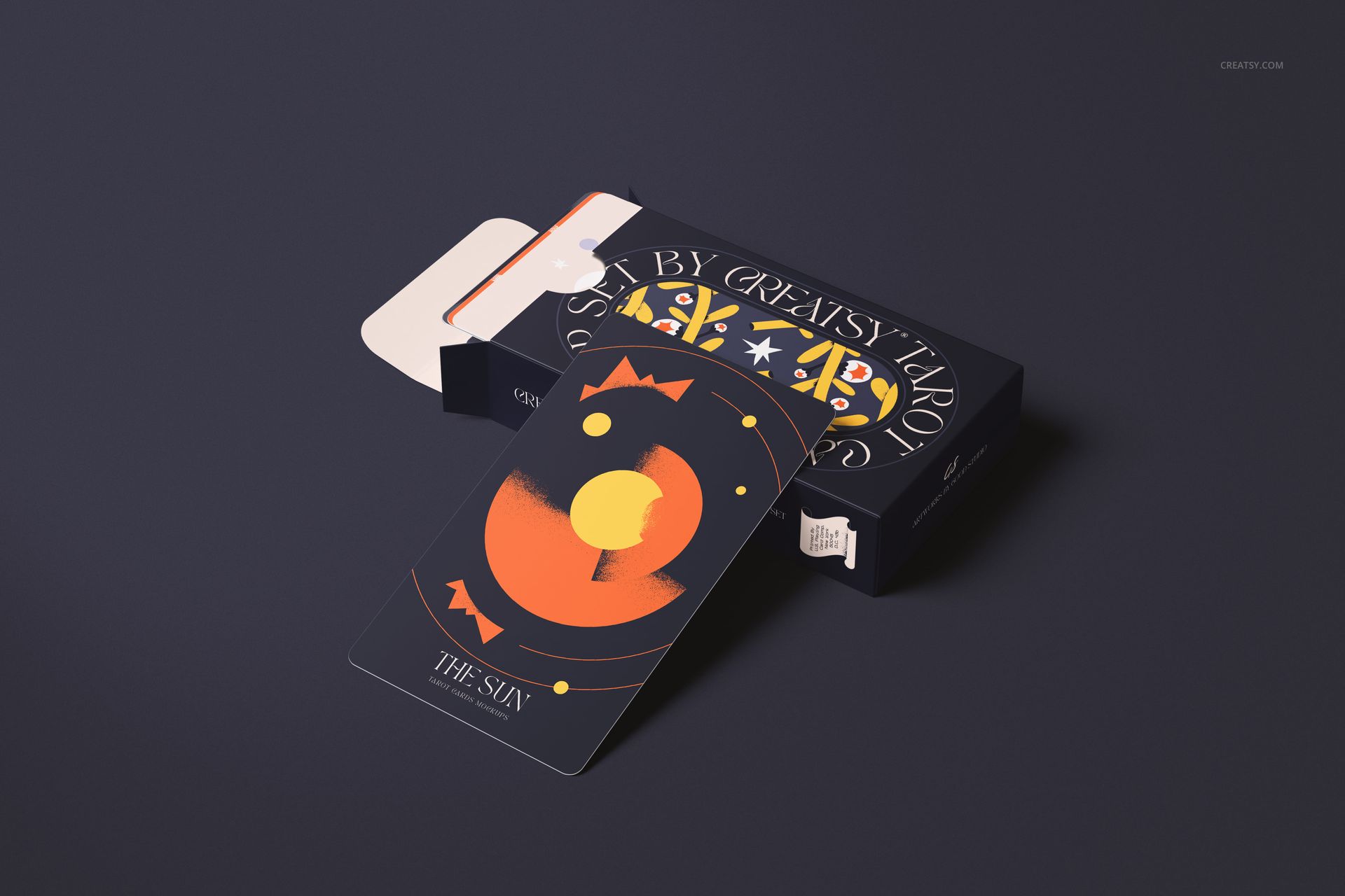 Tarot card mockup featuring a dark box with colorful geometric designs and a card displaying an abstract sun illustration.