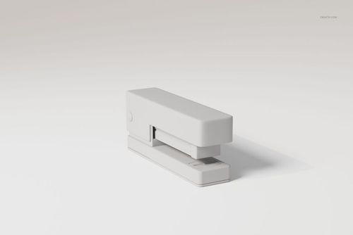 Minimalist modern desk stapler in matte white, shown from a front angle on a plain light background.