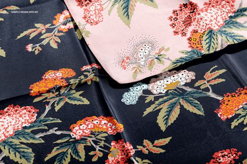 Mockup of silk scarves featuring botanical designs in contrasting dark and light backgrounds, shown from above.
