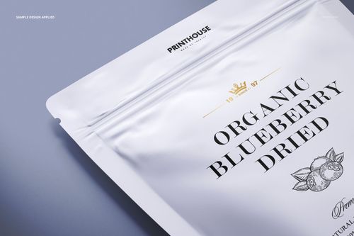 Matte stand up zip lock pouch mockup shown from a close-up angled top view, featuring a light gray background.