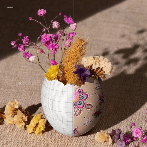Painted Easter egg shell mockup featuring dried flowers and wheat, shown in a close-up on a textured fabric surface.