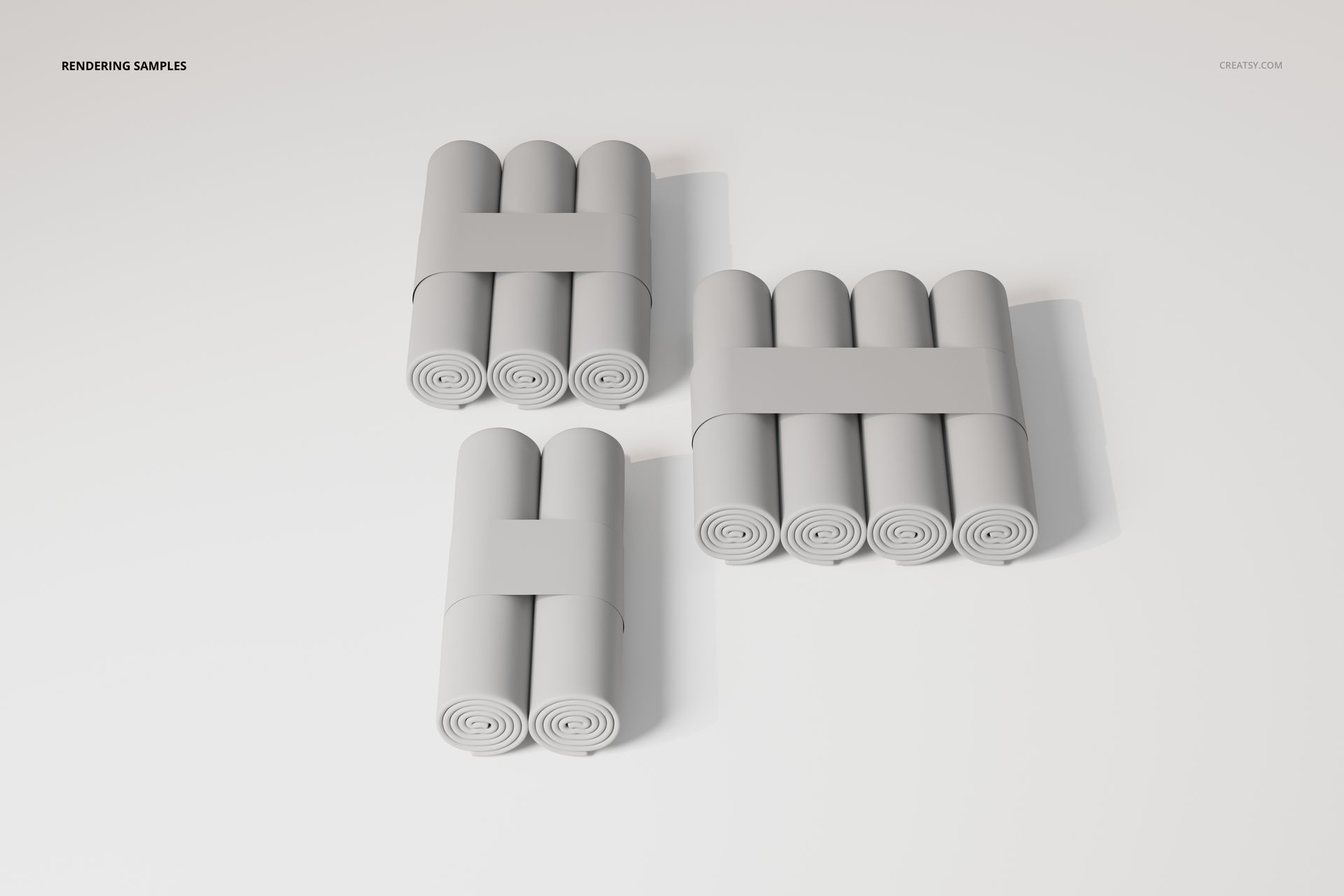 Three sets of changing pad paper rolls arranged in rectangular bundles, viewed from above on a white surface.