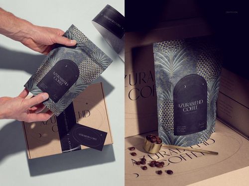Coffee packaging mockup featuring a dark patterned pouch with gold accents, shown in hands and on a branded box.