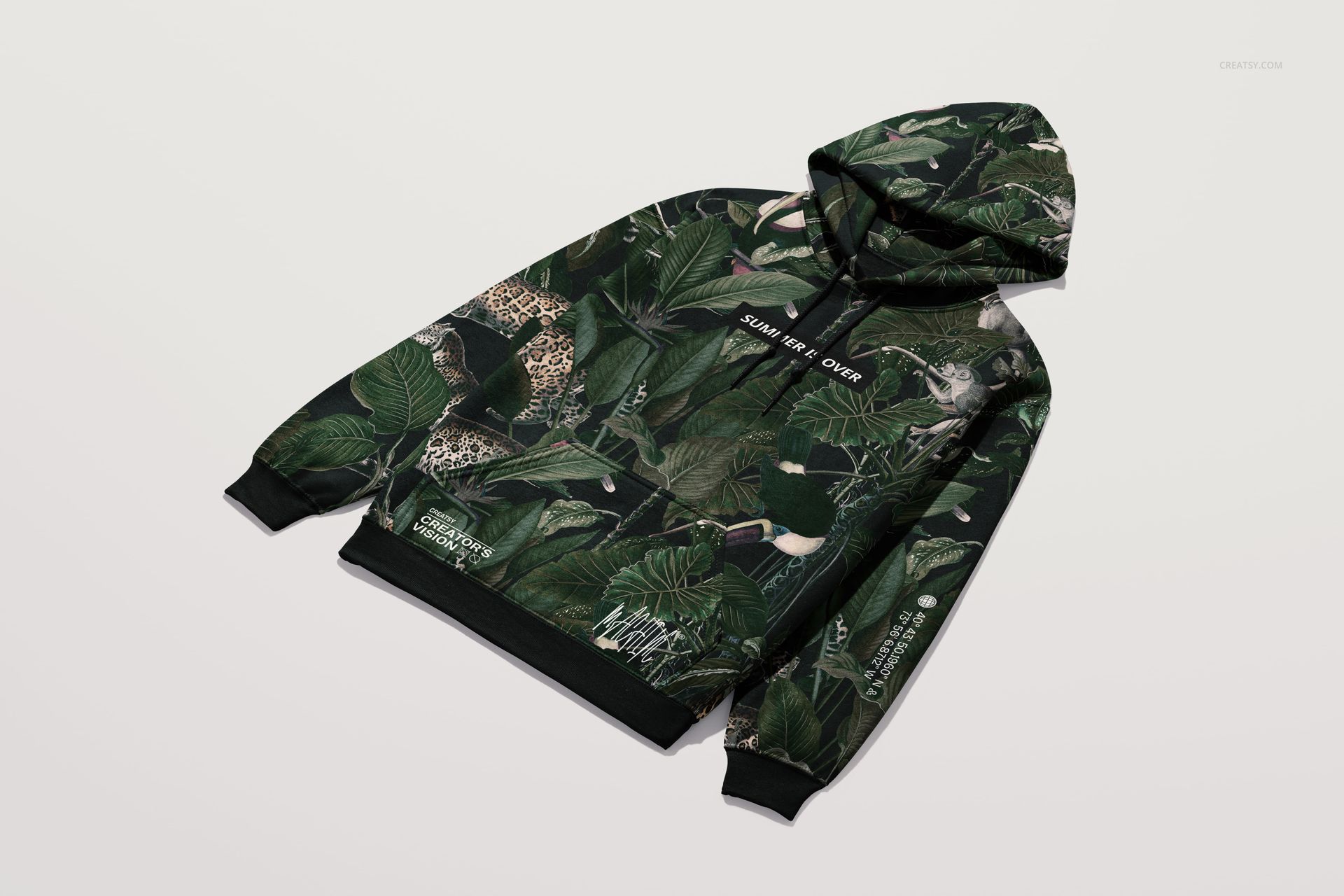 Front angled view of a Gildan 18500 hoodie mockup with a green jungle leaf and animal pattern on a light background.