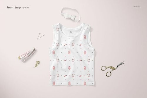 White baby tank top mockup displayed flat with soft pink designs, shown with scissors, tape measure, and sewing pins.