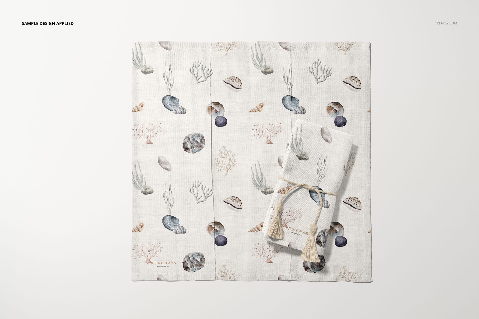 Cotton linen napkin mockup featuring two napkins with a sea-themed pattern, shown from a top view on a light background.