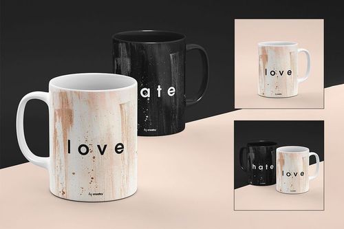 PSD mockup set showing a white mug with 'love' and a black mug with 'hate' on a neutral split background.