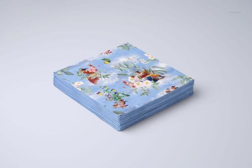 PSD mockup of square napkins with a blue floral print, displayed in a tidy stack against a neutral backdrop.
