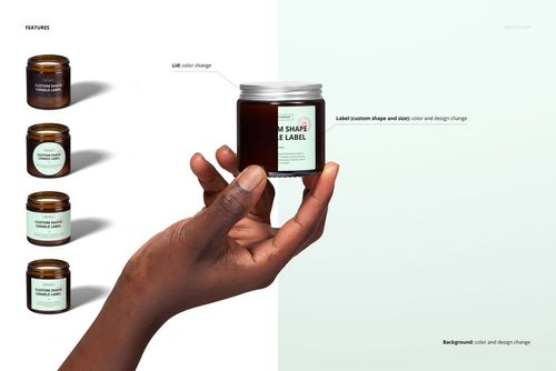 PSD mockup featuring a hand holding an amber candle jar, highlighting label customization and minimalist background.