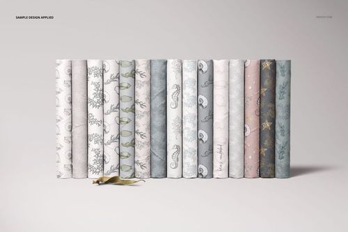 Folded fabrics mockup set featuring fifteen fabric pieces with delicate designs, displayed side by side on a plain surface.