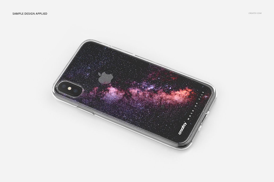 Clear iPhone X case mockup featuring a black phone with a cosmic galaxy pattern, shown in angled top view on white background.