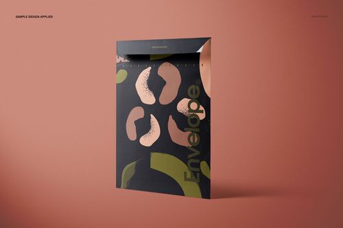 Front view of a rectangular envelope mockup standing upright on a matte brown surface, featuring abstract patterns.