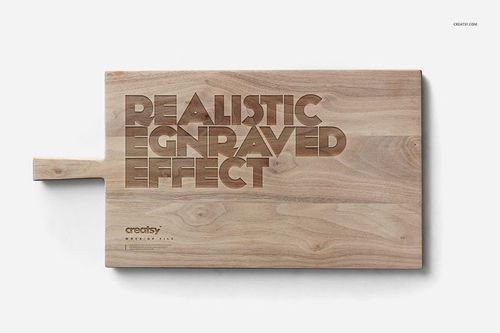Top view of a wooden board mockup with realistic engraved lettering and light brown wood texture on a plain backdrop.