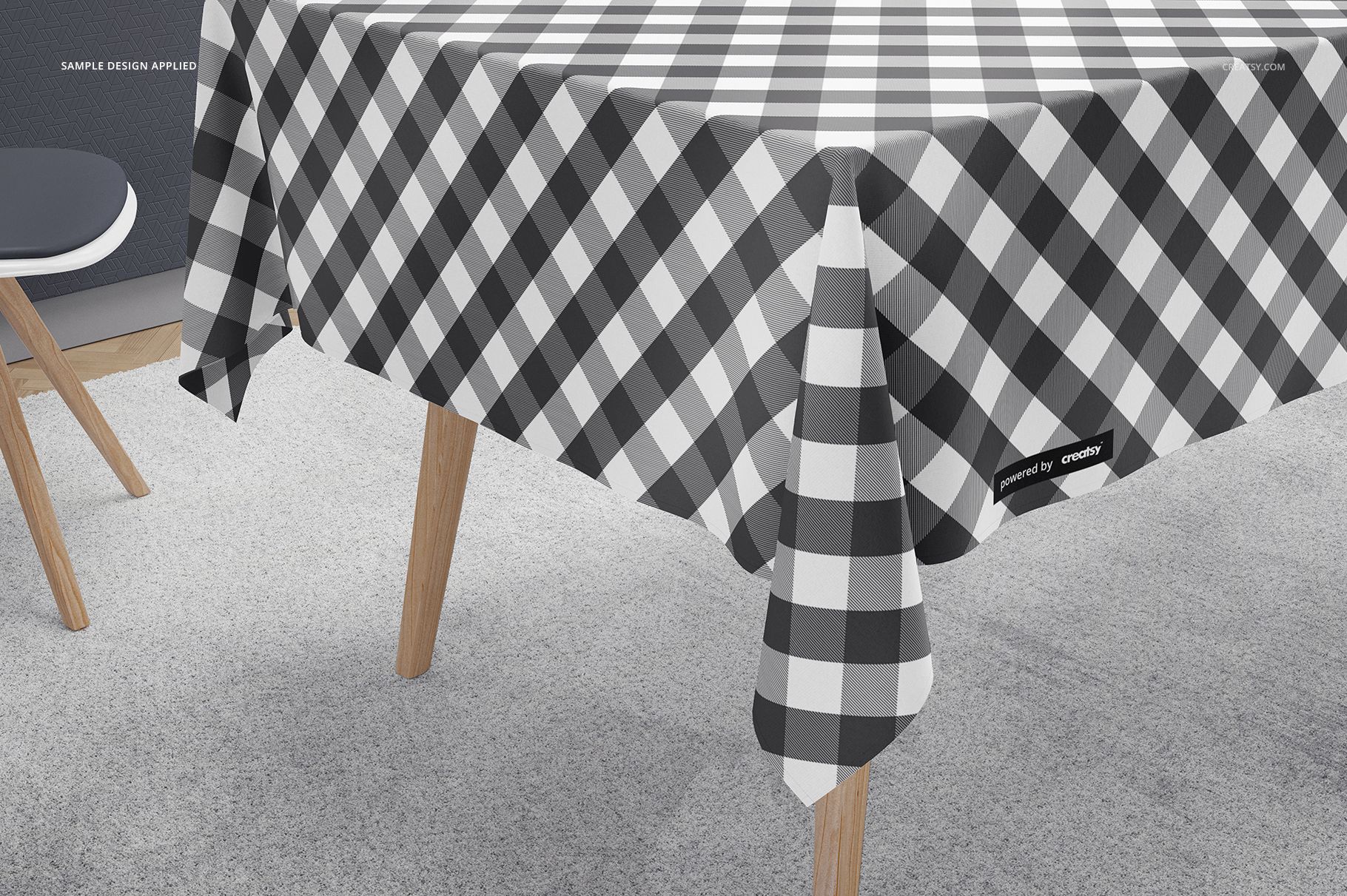 Kitchen Creator PSD mockup featuring a checkered tablecloth on a rectangular table, side perspective with soft lighting.