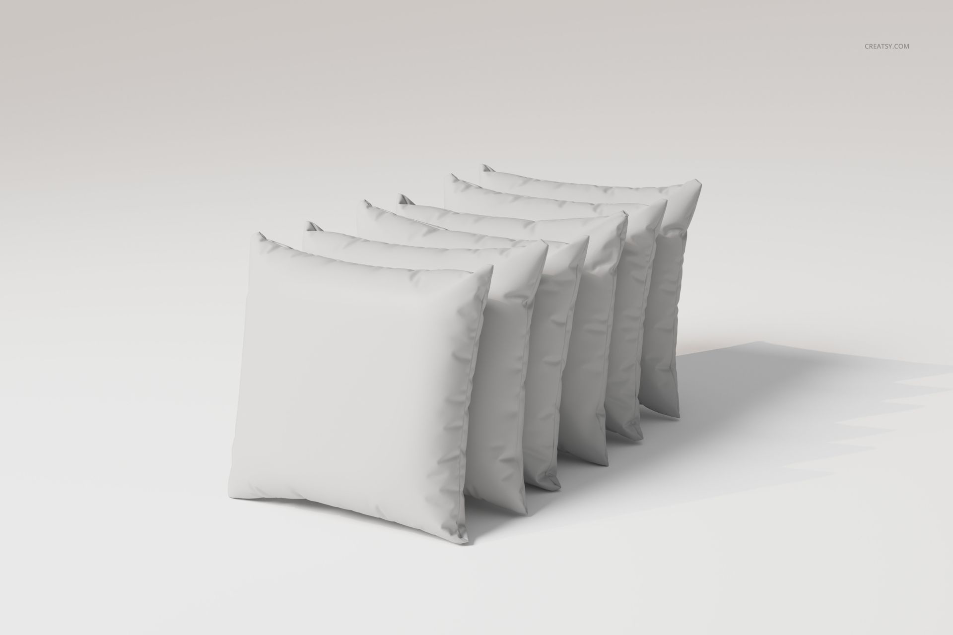 Front view of five square velvet cushions arranged in a row on a plain light background, soft fabric texture visible.