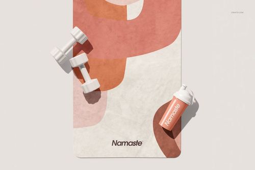 Top view of a yoga mat mockup featuring a soft abstract design, placed beside white dumbbells and a water bottle.