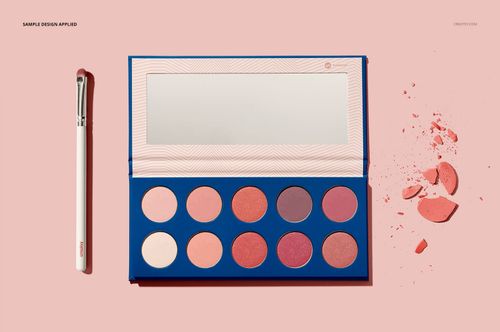 Eyeshadow palette mockup with ten round pans in pink and mauve shades, open to show mirror, on pastel background.