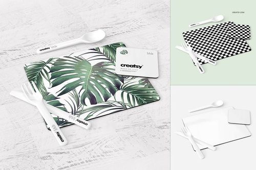 Placemat and coaster set mockup featuring tropical leaf patterns, viewed from above with white utensils on a light surface.