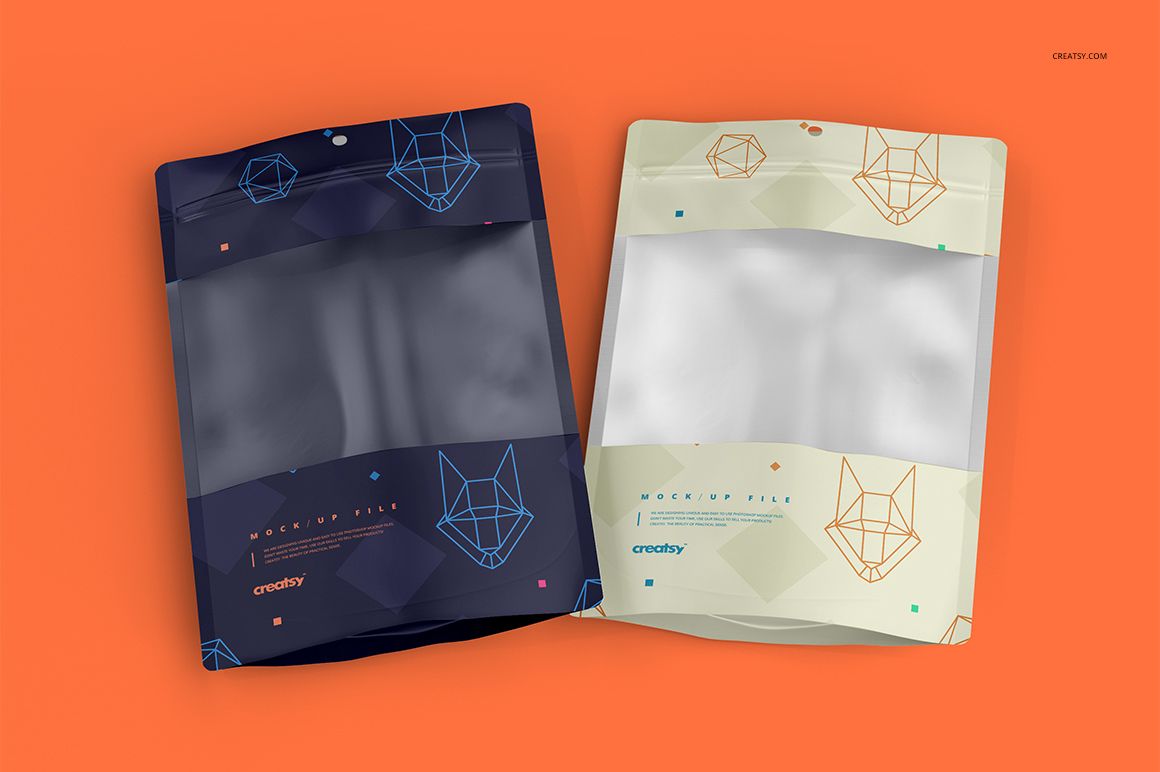 Plastic window bag PSD mockup set showing two bags, one navy and one cream, with clear windows and abstract graphics.